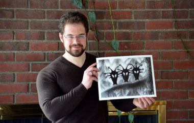 Christopher Paolini holding his print of the Shadow Birds, Halloween