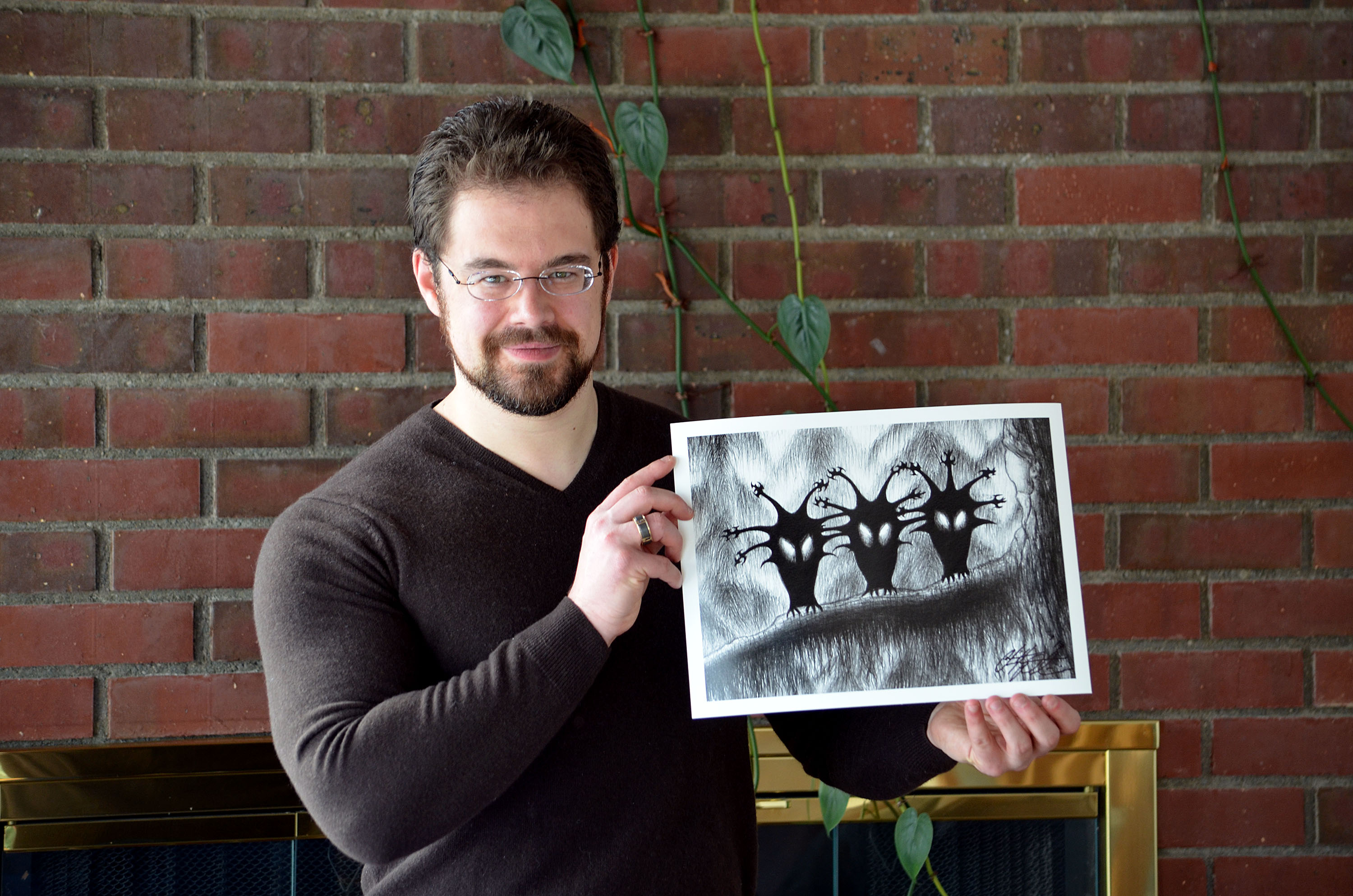Christopher Paolini holding his print of the Shadow Birds, Halloween