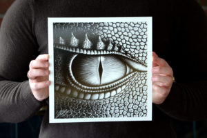 Detail of Christopher Paolini holding his print of Saphira's Eye.
