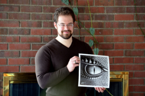 Christopher Paolini holding his print of Saphira's Eye.
