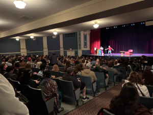 Murtagh Naperville 2023, fans watch as Christopher Paolini prepares to come on stage for an event hosted by Anderson Books at North Central College in November 2023